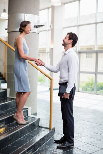 istock Business executives shaking hands with each other 653951104