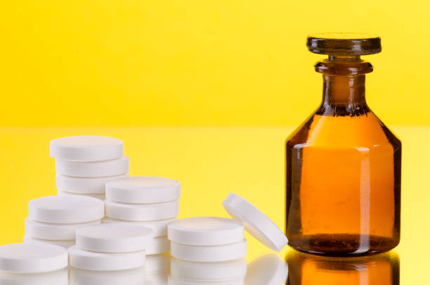 istock pills with glass bottle 653951130