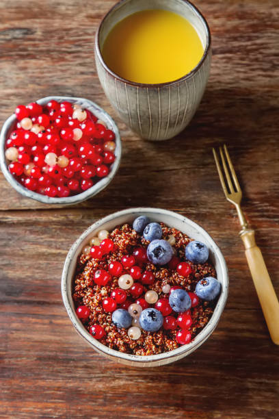 A healthy breakfast. Quinoa with berries in the old plate. Fresh