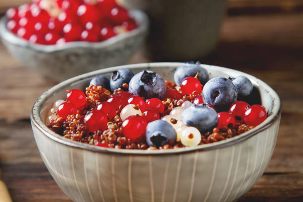 A healthy breakfast. Quinoa with berries in the old plate. Fresh