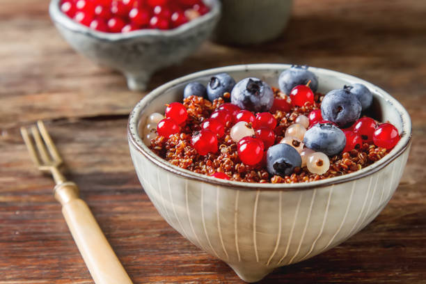 A healthy breakfast. Quinoa with berries in the old plate. Fresh
