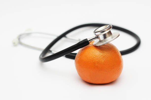 Stethoscope and orange isolated stock photo