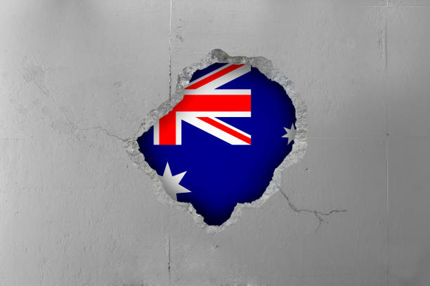 istock Australian flag behind a concrete wall. 653965098
