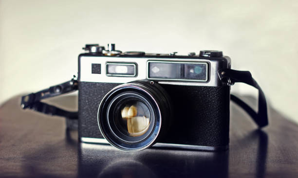 istock Vintage Slr camera on a wooden 653965142