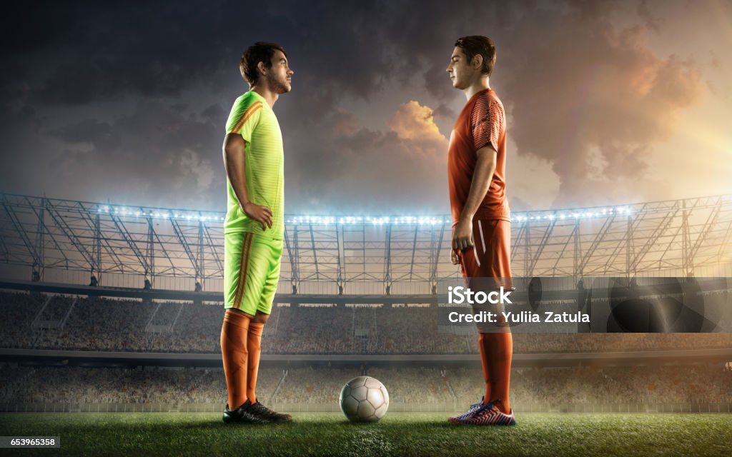 two soccer team captains on a stadium two soccer team captains on a stadium with a ball Face To Face Stock Photo