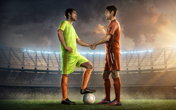 soccer team captains shaking hands two soccer team captains on a soccer field shaking hands before the game team captain stock pictures, royalty-free photos & images