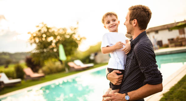 istock family have fun with the son for fathers day 653966100