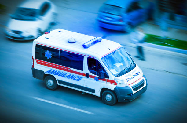 istock Ambulance van with flashing lights 653967176