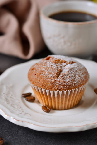 istock Vanilla muffins with fresh coffee for breakfast on a black background 653967852