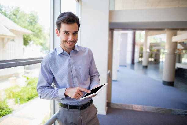 istock Businessman holding digital tablet 653968790