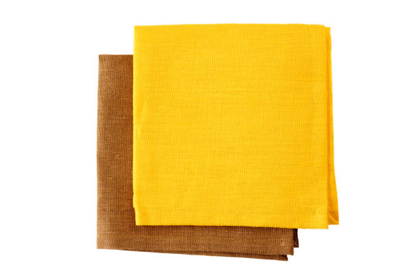 istock Two colorful napkins, yellow and brown, on white 653972252