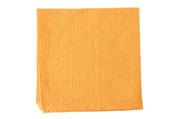 Pale orange textile napkin isolated on white background