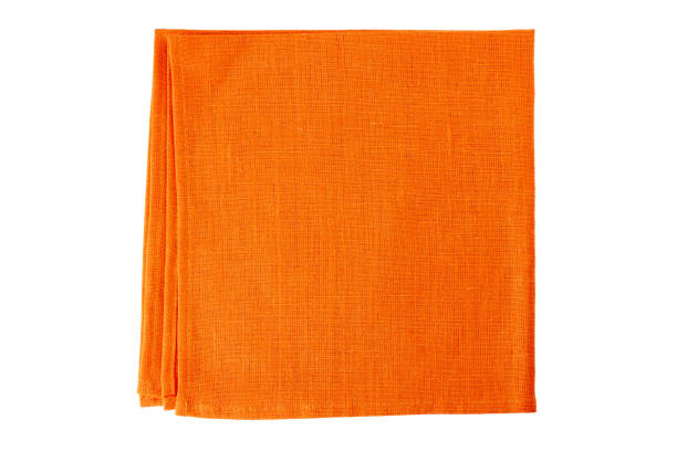 Orange textile napkin on white stock photo