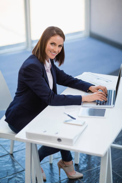 istock Businesswoman using laptop 653973928