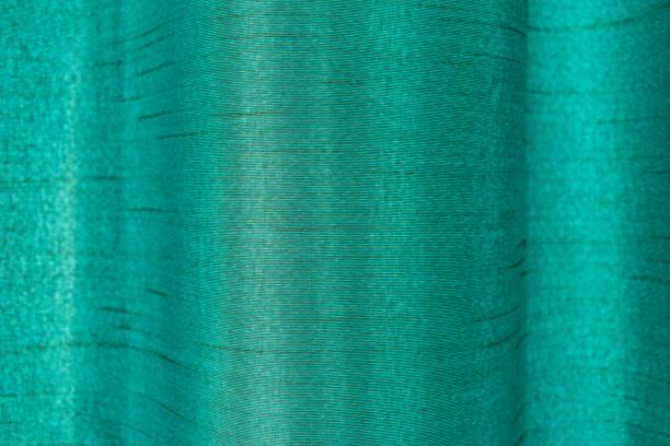 istock Green abstract satin curtain background 653978426