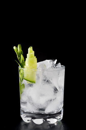 cocktail drink on plain background ice cold black bar restaurant space for text