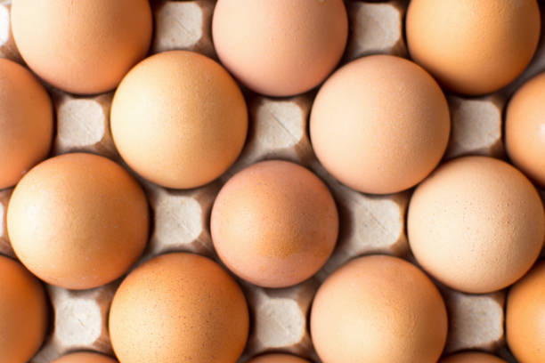 istock Bunch of chicken eggs in cardboard box 653982028
