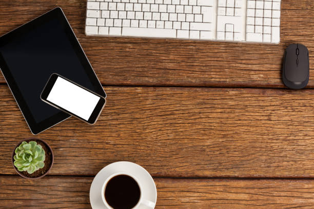 istock Digital tablet, keyboard, and smartphone with cup of coffee 653990630