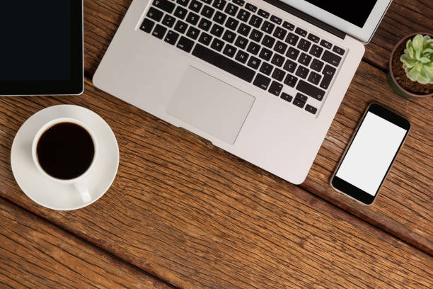 istock Digital tablet, laptop and smartphone with cup of coffee 653990670