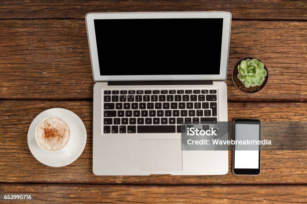 Digital Tablet Laptop And Smartphone With Cup Of Coffee Stock Photo - Download Image Now