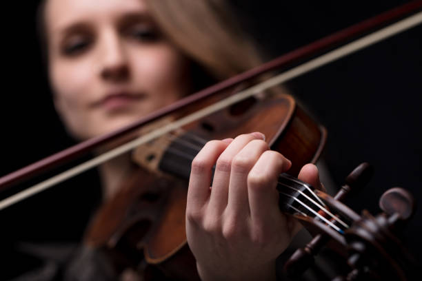 istock hand of a violinist playing 653997292