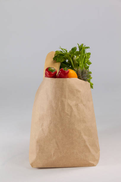 istock Fruits and vegetables in brown grocery bag 653997322