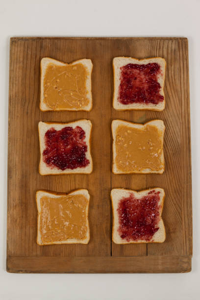 istock Bread slices with jam and peanut butter 654003284