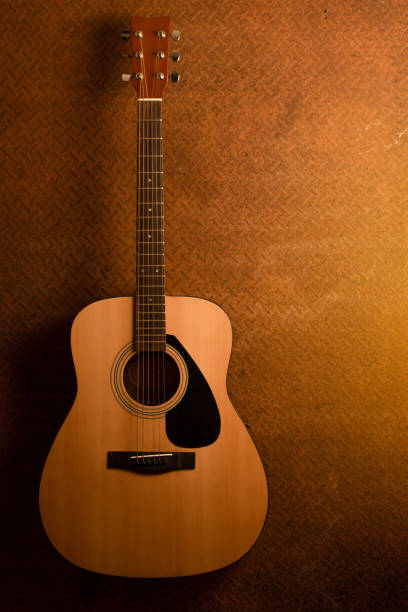 istock Acoustic guitar on old steel background 654003446
