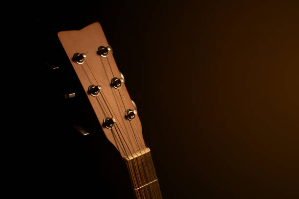 istock Acoustic guitar on black background with copy space,head part 654003490