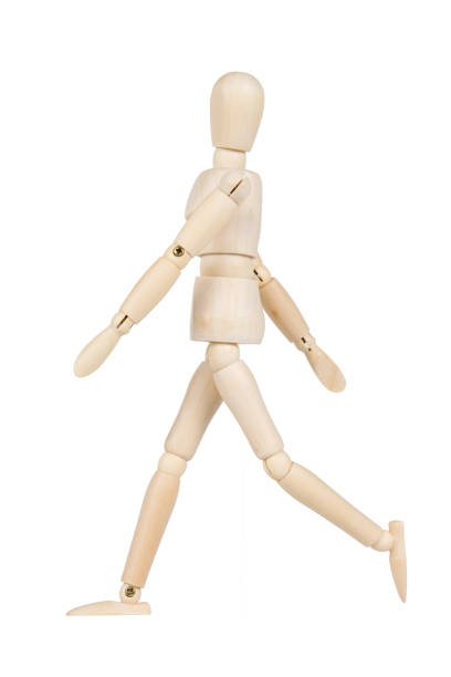 istock Wooden model walking isolated on a white background. 654005954