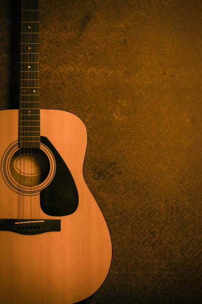 istock Acoustic guitar on old steel background 654006360