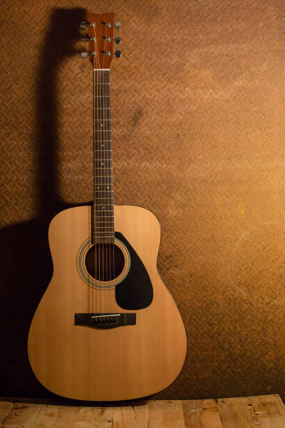 istock Acoustic guitar on old steel background 654006952