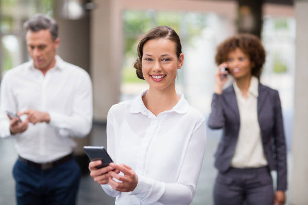 istock Business executive holding mobile phone 654010350