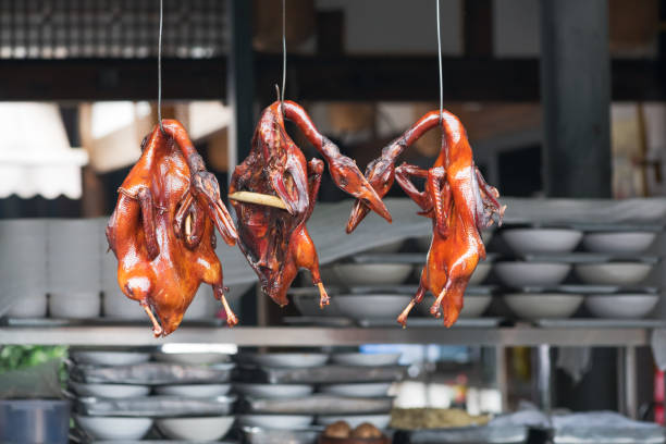istock Peking duck hanging in a kitchen of a chinese restaurant 654013550