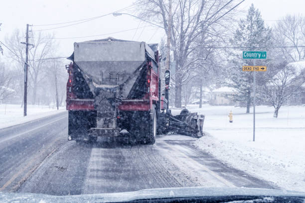 istock Large Snowplow Dump Truck Turning Off Highway at Road Intersection 654013716