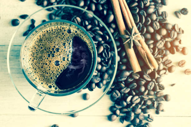 istock cup of coffee and coffee bean on wood table 654014054
