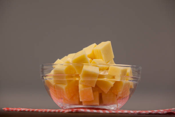 Feta cheese cut in cubes stock photo. Shadow DOF. Developed from RAW; retouched with special care and attention; Small amount of grain added for best final impression. 16 bit Adobe RGB color profile.
