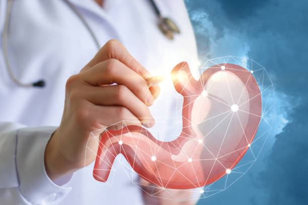 istock Doctor showing a stomach. 654036274