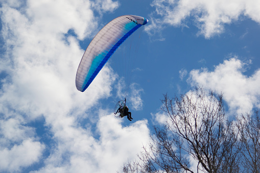 BERDYANSK, UKRAINE - APRIL 16, 2012: The unknown person pilots on a parachute.