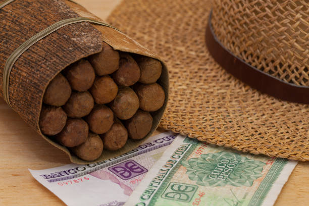 istock Luxury Cuban cigars and money 654042750