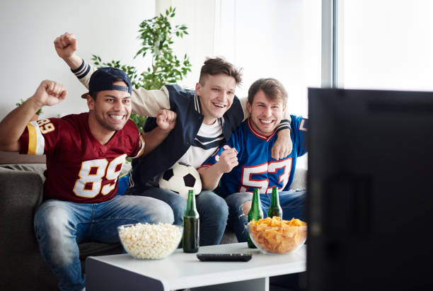 istock Top view of cheering guys at home 654042774