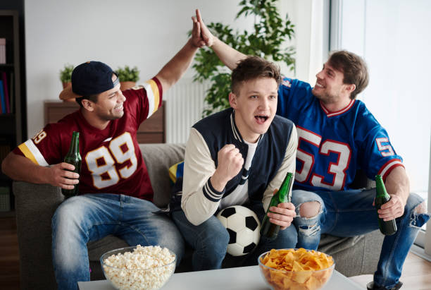 istock Friends supporting their soccer team 654043148