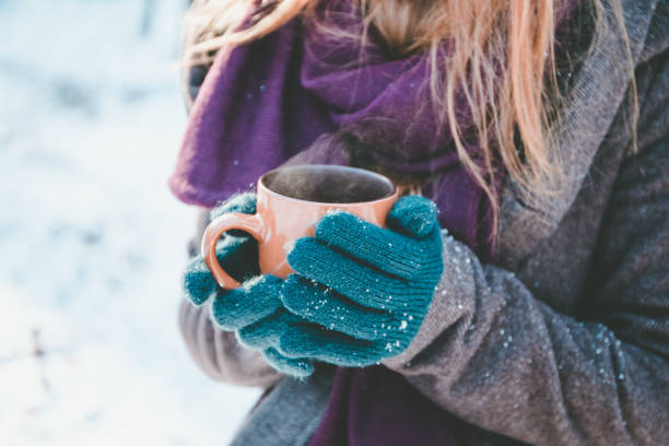 istock Young woman drinking hot drink 654043854