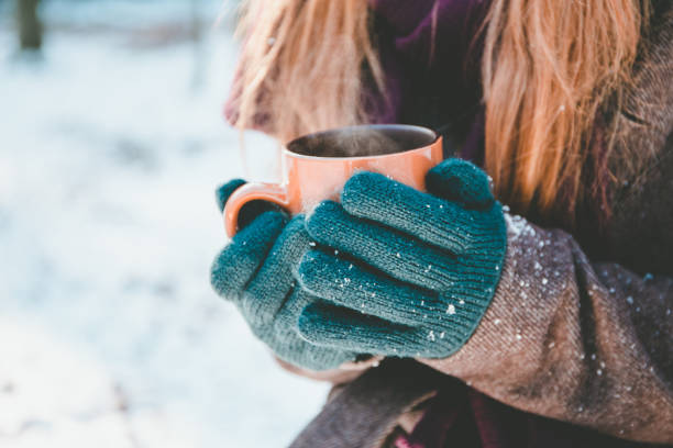 istock Young woman drinking hot drink 654043856