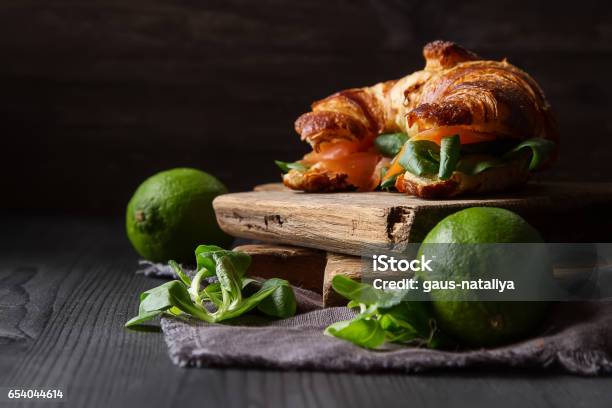 French Food For Breakfast Baked Croissant Sandwich With Salmon Stock Photo - Download Image Now