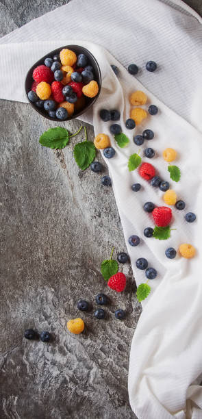 istock Ripe berries. White, red raspberries and blueberries in brown cu 654050466