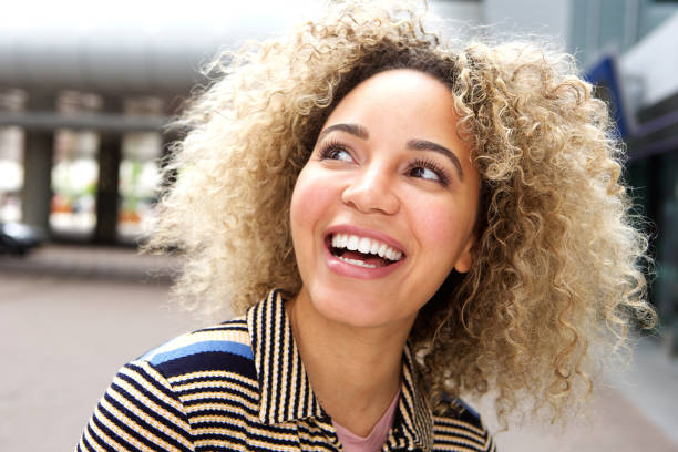 istock Smiling young woman outside 654054968