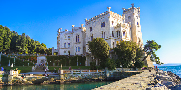 Miramare Castle (Italian: Castello di Miramare; German: Schloss Miramar; Slovene: Grad Miramar) is a 19th-century castle on the Gulf of Trieste near Trieste, Italy. It was built from 1856 to 1860 for Austrian Archduke Ferdinand Maximilian and his wife, Charlotte of Belgium, later Emperor Maximilian I and Empress Carlota of Mexico, based on a design by Carl Junker.