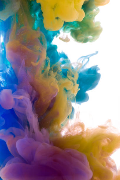 istock Colors dropped into liquid and photographed while in motion. Ink shape or swirling in water for design or decorate background or abstract banner on white isolate background. 654056830