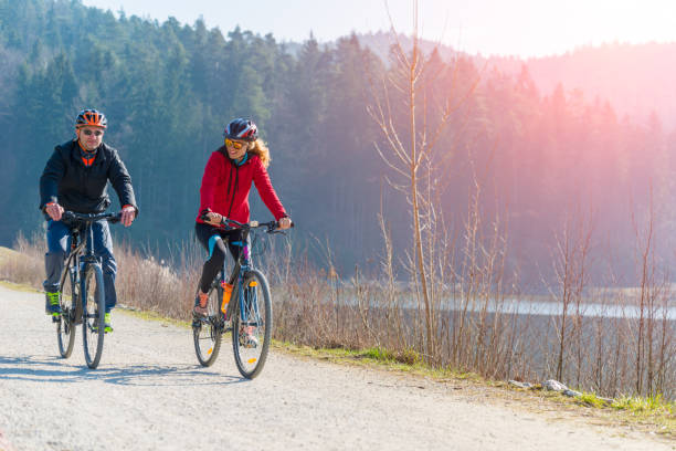 istock Couple Cycling Through Countryside Together 654061040
